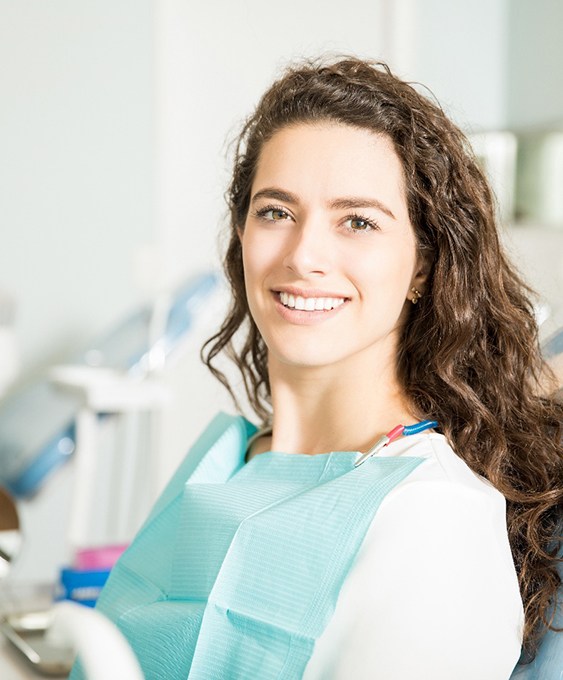 A smiling woman at the dentist