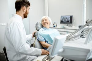 Dentist having friendly conversation with patient 